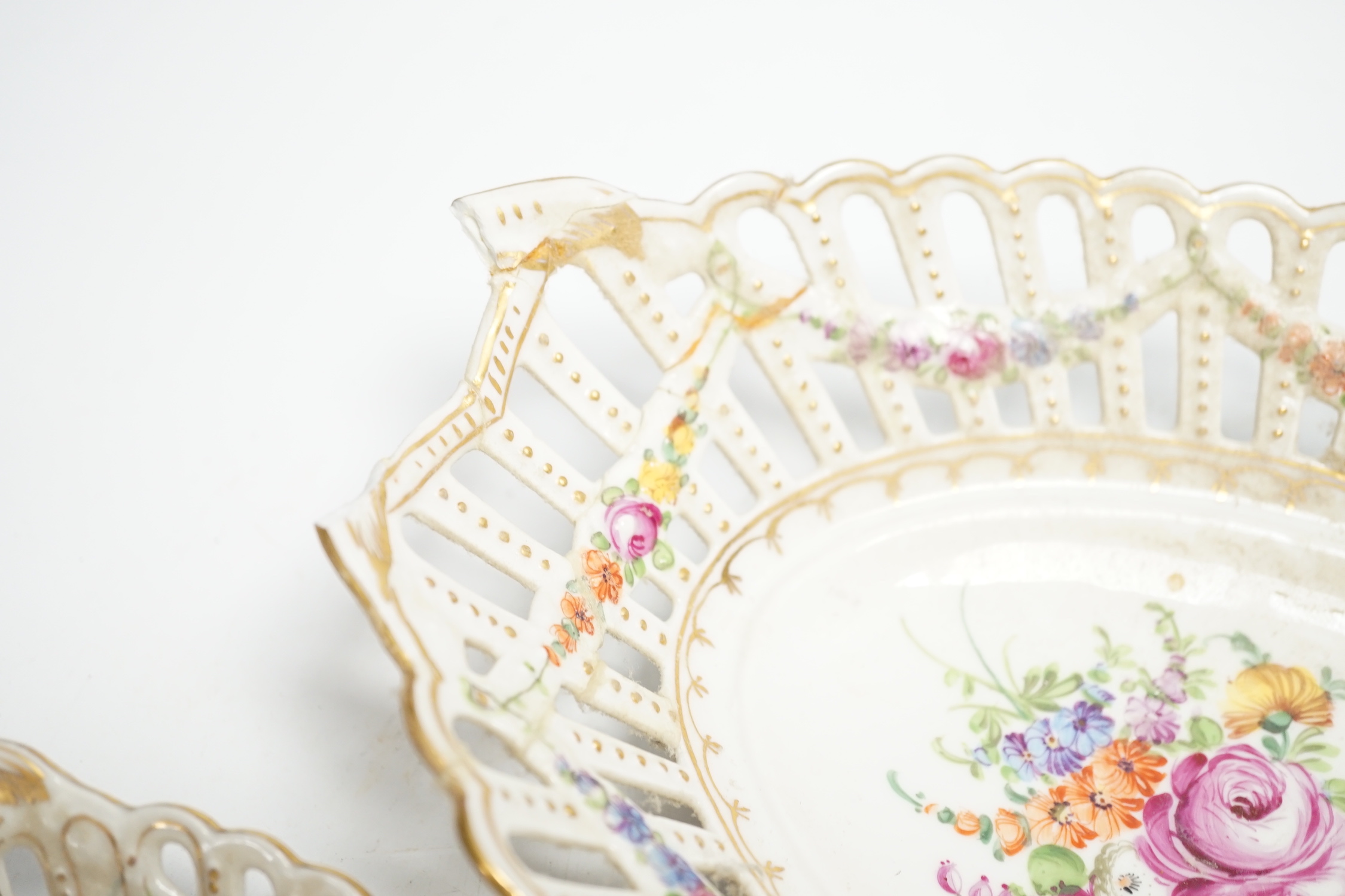 A trio of Dresden pierced floral painted porcelain oval baskets